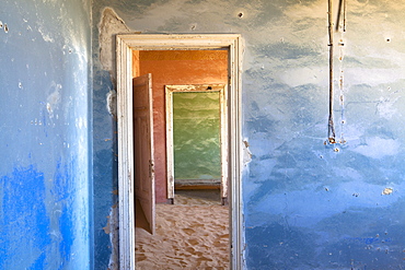 Interior of building slowly being consumed by the sands of the Namib Desert in the abandoned former German diamond mining town of Kolmanskop, Forbidden Diamond Area near Luderitz, Namibia, Africa 