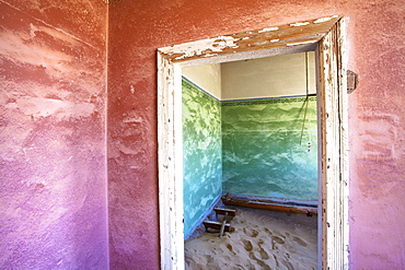 Interior of building slowly being consumed by the sands of the Namib Desert in the abandoned former German diamond mining town of Kolmanskop, Forbidden Diamond Area near Luderitz, Namibia, Africa 