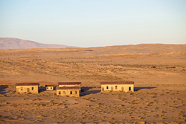 Buildings in the abandoned former German diamond mining town of Kolmanskop on the edge of the Namib Desert, Forbidden Diamond Area near Luderitz, Namibia