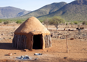 Traditional mud-covered dwelling in a Himba village in the Kunene Region, formerly Kaokoland, in the far north of Namibia, Africa 