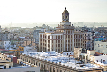 View over rooftops of Havana towards The Bacardi Building from the 9th floor restaurant of Hotel Seville, Havana Centro, Cuba