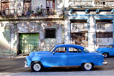 Blue vintage American car parked on a street in Havana Centro, Havana, Cuba, West Indies, Central America