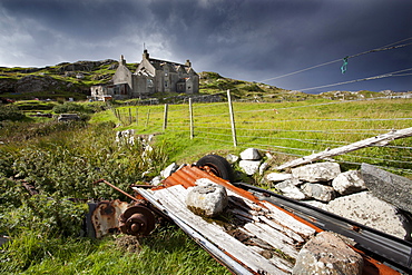 Abandoned croft beneath a stormy sky in the township of Manish on the east coast of The Isle of Harris, Outer Hebrides, Scotland