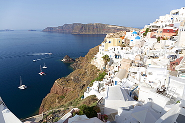 Classic view of the village of Oia with its blue domed churches and colourful houses, Oia, Santorini, Cyclades, Greek Islands, Greece, Europe