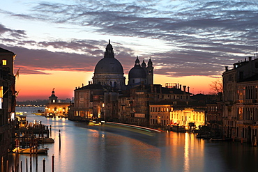 View along Grand Canal towards Santa Maria Della Salute from Accademia Bridge at dawn, Venice, UNESCO World Heritage Site, Veneto, Italy, Europe