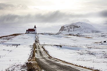 Isolated church (Ingjaldscholskirkja) in winter near Rif on the Snaefellsnes Peninsula, Iceland, Polar Regions