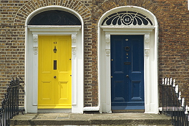 Two doorways with painted doors on Bride Street in Dublin, Eire, Europe