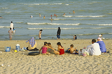 Family on city beach, Kuwait City, Kuwait, Middle East