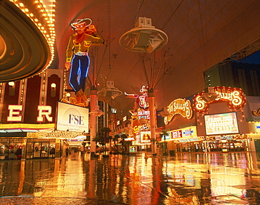 Reflections of neon lights and signs along Fremont Street in Las Vegas, Nevada, United States of America, North America