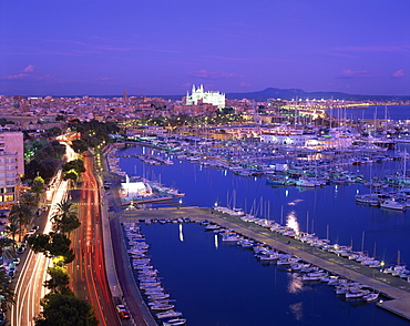 Evening lights, with boats in the marina and Palma cathedral across the bay, on Majorca, Balearic Islands, Spain, Mediterranean, Europe