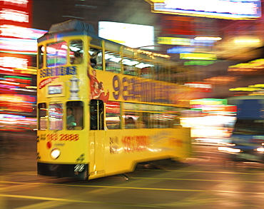 Tram in blurred motion at dusk, Causeway Bay, Hong Kong, China, Asia