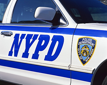 Close-up of police car with insignia of the City of New York Police Department, NYPD, on the side, in New York, United States of America, North America