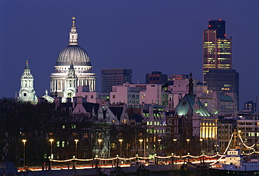 City skyline, including St.Paul's Cathedral and the NatWest Tower, from across the Thames at dusk, London, England, United Kingdom, Europe