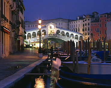 The Rialto Bridge illuminated at night in Venice, UNESCO World Heritage Site, Veneto, Italy, Europe