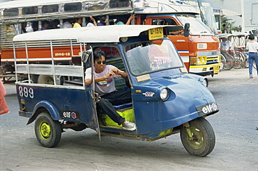 Driver of local transport vehicle on the road in Ayutthaya, Thailand, Southeast Asia, Asia