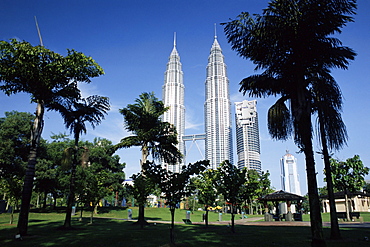 Petronas twin towers seen from public park, Kuala Lumpur, Malaysia, Southeast Asia, Asia