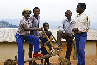 Children with home made scooter, Ruwenzoris area, eastern Zaire, Africa