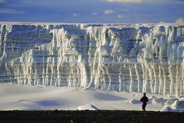 Glacier and trekker from summit at Uhuru Peak, Kilimanjaro National Park, Tanzania, Africa