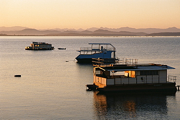 Houseboats at dawn at Cutty Sark Hotel marina, Lake Kariba, Zimbabwe, Africa