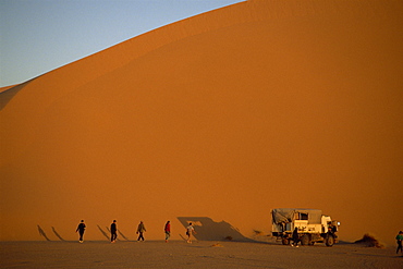 People and truck by large dune, Amguid, Sahara Desert, Algeria, North Africa, Africa