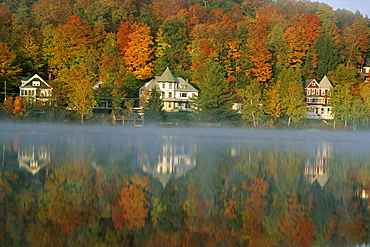 Large houses beside Lake Flower at Saranac Lake Town in early morning, Adirondack area, New York State, United States of America (U.S.A.), North America