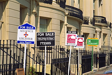 For sale signs outside Georgian terrace, Brighton and Hove, Sussex, United Kingdom, Europe