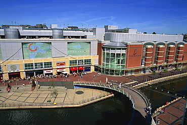 Eastern end of the Oracle shopping complex with curved footbridge over River Kennet and Debenham's store, Reading, Berkshire, England, United Kingdom, Europe