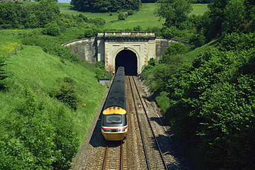 High speed train emerging from tunnel in the Box Valley, Avon, England, United Kingdom, Europe