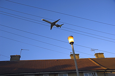 Aeroplane above houses, Hounslow, Greater London, England, United Kingdom, Europe