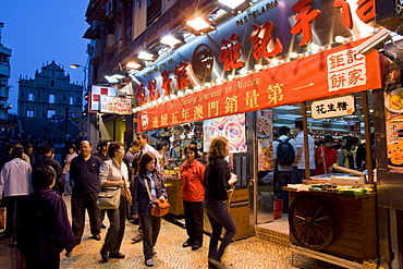 Street scene and St. Paul's cathedral in distance, Macau, China, Asia