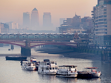 Canary Wharf partially obscured by river mist behind Blackfriars Bridge, London, England, United Kingdom, Europe