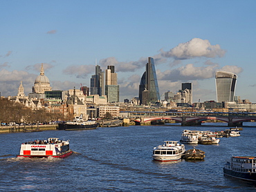 Classic cityscape across Blackfriars Bridge shows City CBD and St. Pauls Cathedral, London, England, United Kingdom, Europe