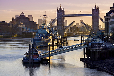 Tower Bridge raising deck with HMS Belfast on the River Thames, London, England, United Kingdom, Europe