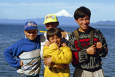 Portrait of men and children at Osorno Lake in the Lake District of Chile, South America