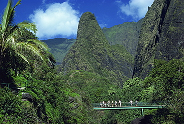 Tourists crossing bridge under the Maui Iao Needle, Hawaii, United States of America, North America