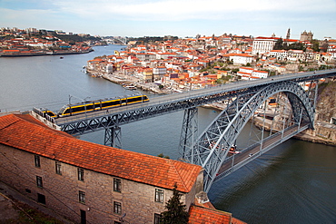 The Dom Luis 1 Bridge over the River Douro showing Porto Metro light rail in transit and Arrabida Bridge in background, Porto (Oporto), Portugal, Europe