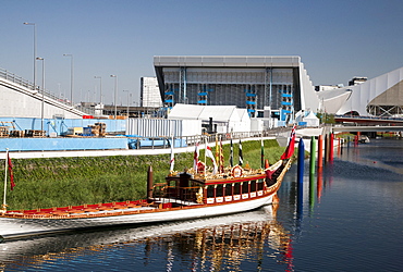 The Royal Barge Gloriana at the Olympic Park showing the Aquatics Centre in background, Stratford, London, England, United Kingdom, Europe