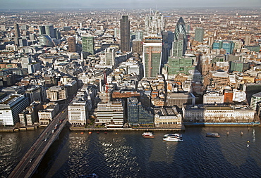 Aerial view of the City from the top of the Shard showing River Thames, London Bridge, 30 St. Mary Axe (The Gherkin), Tower 42, the Willis Building, and Moorhouse, London, England, United Kingdom, Europe