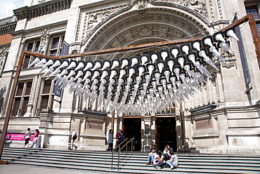 People sitting on main entrance steps to Victoria and Albert Museum, Kensington, London, England, United Kingdom, Europe