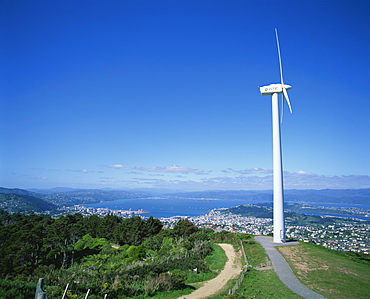 ECNZ Wind turbine generator on a hill above the city and harbour of the city of Wellington, New Zealand, Pacific