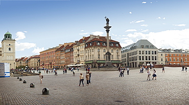 Tourists walk across Castle Square Plac Zamkowy, site of Sigismund's Column and Royal Castle, Old Town rebuilt after World War II, UNESCO World Heritage Site, Warsaw, Poland, Europe