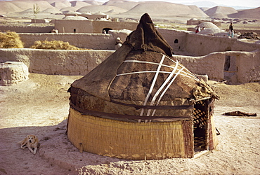 Tent or yurt of nomads pitched inside low walls at Murghaz in northern Afghanistan, Asia