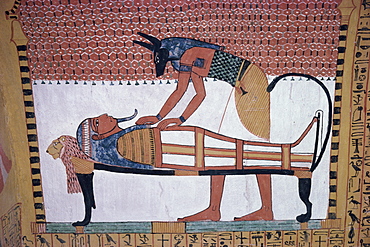 Mural showing the god Anubis leaning over mummy of Ramses II, in the Tomb of Sinjin, chief artist to Ramses II, Deir el Medina, Thebes, UNESCO World Heritage Site, Egypt, North Africa, Africa