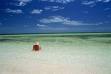 Woman in the sea on the beach at Cayo Coco on the island of Cuba, West Indies, Central America