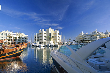 Luxury boat and the Marina, Malaga, Benalmadena-Costa (Costa del Sol), Andalucia (Andalusia), Spain, Europe