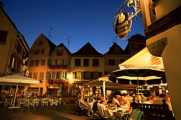 Dining at night in the Place de l'Ancienne Douane, Colmar, Haut-Rhin, Alsace, France, Europe