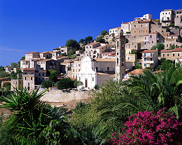 View of church and village on hillside, Lumio, near Calvi, Haute-Corse, Corsica, Mediterranean, France, Europe