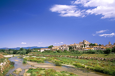 View to village across river, Peralada, near Figueras, Gerona, Catalonia (Cataluna) (Catalunya), Spain, Europe