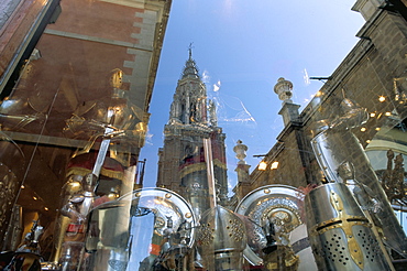 Cathedral reflected in window of shop selling medieval armour, Toledo, Castilla-La Mancha, Spain, Europe