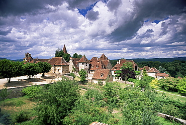 The village amidst the verdant surroundings of the Dordogne valley, Carennac, Lot, Midi-Pyrenees, France, Europe